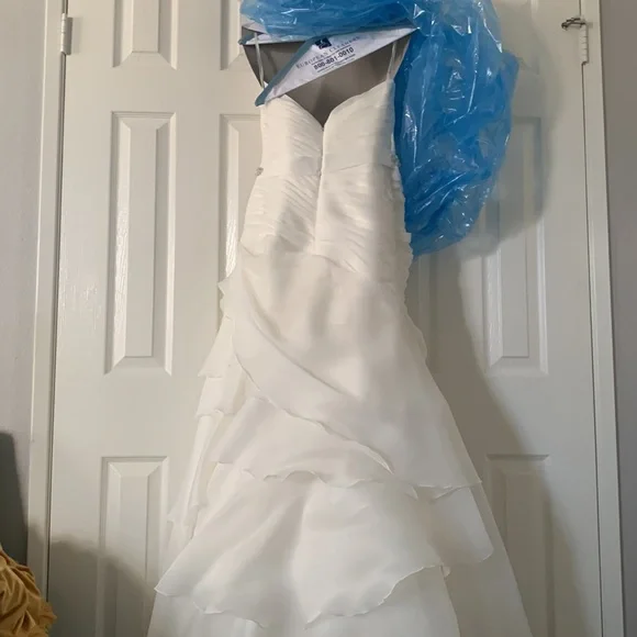 Beautiful off white Demtria cascading wedding dress.  Size 10, but altered. - Picture 10 of 12